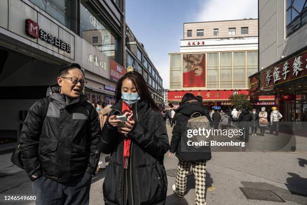 Shoppers in the Guanqian Street shopping area in Suzhou, Jiangsu province, China, on Wednesday, Jan. 25, 2023. China's Lunar New Year travel and box...