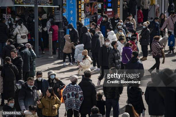 Shoppers in the Guanqian Street shopping area in Suzhou, Jiangsu province, China, on Wednesday, Jan. 25, 2023. China's Lunar New Year travel and box...