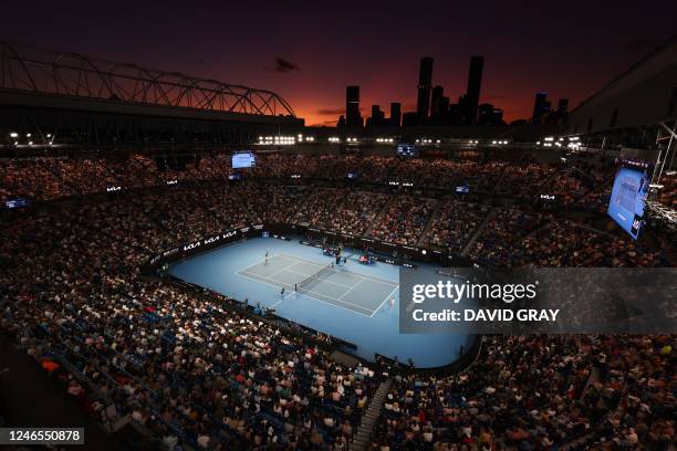 General view shows Rod Laver Arena after sunset during the women's singles semi-final match between Belarus' Victoria Azarenka and Kazakhstan's Elena...