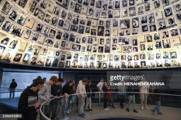 Visitors tour the Hall of Names at the Yad Vashem Holocaust Memorial museum in Jerusalem on January 26 a day ahead of the International Holocaust...