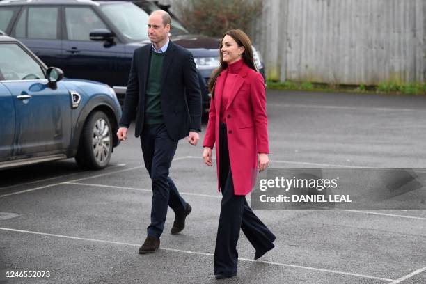 Britain's Catherine, Princess of Wales and Britain's Prince William, Prince of Wales arrive to visit the Windsor Foodshare, in Windsor, on January...