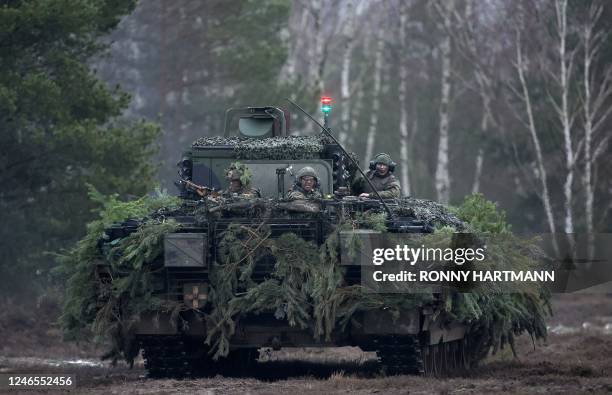 German soldiers drive a Puma infantry fighting vehicle of the German armed forces Bundeswehr during an exercise at a military training area in...