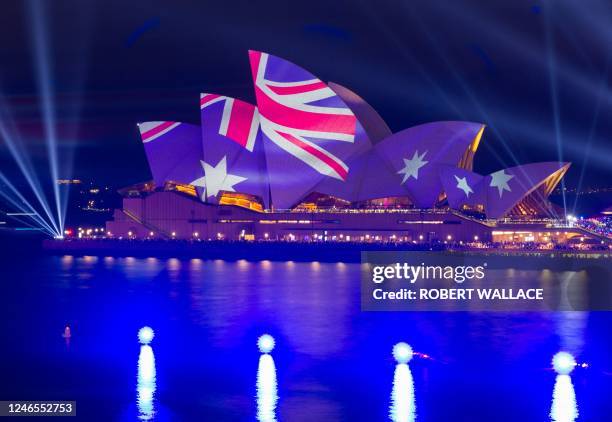 This picture shows the Opera House illuminated in the colours of the Australian flag in Sydney on Australia Day on January 26, 2023.