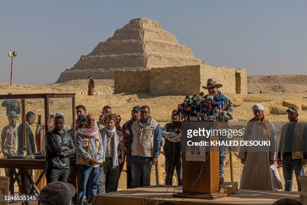 Archaeologist and Egypt's former antiquities minister Zahi Hawass holds a press conference in the Saqqara necropolis, where a gold-laced mummy and...