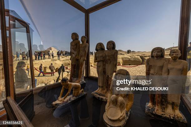 Collection of pharaoh statues is on display during a press conference at the Saqqara necropolis, where a gold-laced mummy and four tombs including of...