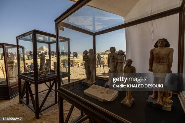 Collection of pharaoh statues is on display during a press conference at the Saqqara necropolis, where a gold-laced mummy and four tombs including of...