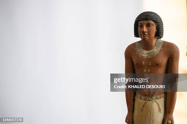 Pharaoh statue is on display during a press conference at the Saqqara archaeological site, where a gold-laced mummy and four tombs including of an...