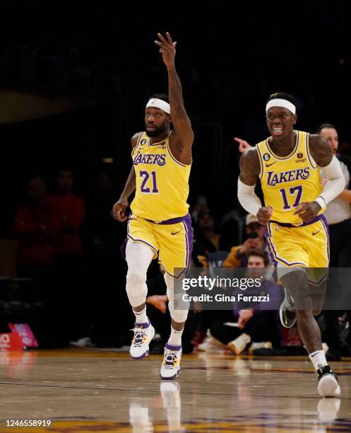 Los Angeles Lakers guard Patrick Beverley reacts with Los Angeles Lakers guard Dennis Schroder after sinking a 3-pointer against the San Antonio...
