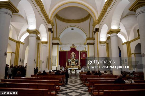 Relatives of the victims gather and pray in a church where an attack happened, in Alta square, in Algeciras, southern Spain, on January 26, 2023. -...