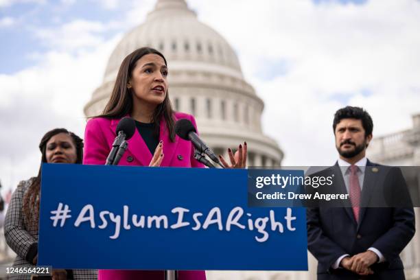 Flanked by Rep. Cori Bush and Rep. Greg Casar , Rep. Alexandria Ocasio-Cortez speaks during a news conference with Democratic lawmakers about the...