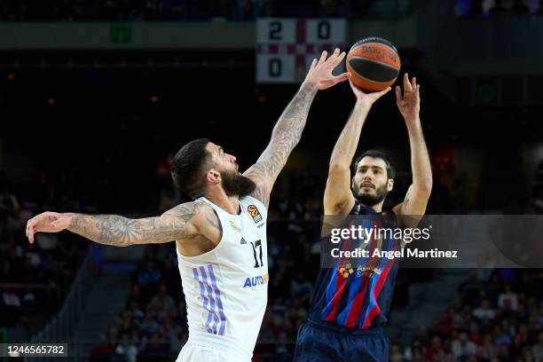 Alex Abrines, #21 of FC Barcelona shoots the ball against Vincent Poirier, #17 of Real Madrid during the 2022/2023 Turkish Airlines EuroLeague match...