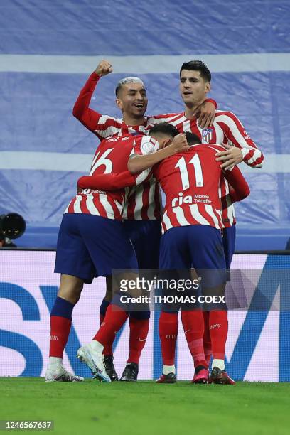 Atletico Madrid's Spanish forward Alvaro Morata celebrates with teammates after scoring his team's first goal during the Copa del Rey , quarter final...