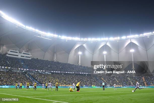 Cristiano Ronaldo of Al Nassr FC takes a free kick inside the King Fahd International Stadium during the Saudi Super Cup match between Al Ittihad and...