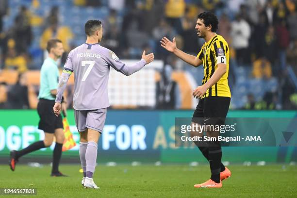 Cristiano Ronaldo of Al Nassr FC and Ahmed Hegazi of Al Ittihad Club at the end of the game during the Saudi Super Cup match between Al Ittihad and...