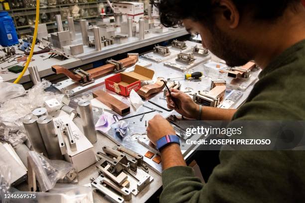 Intern engineer Smeet Patel assembles fusion reactor core components at the Massachusetts Institute of Technology Plasma Science & Fusion Center in...