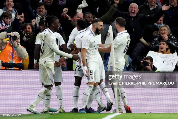 Real Madrid's French forward Karim Benzema celebrates scoring his team's second goal with teammates during the Copa del Rey , quarter final football...