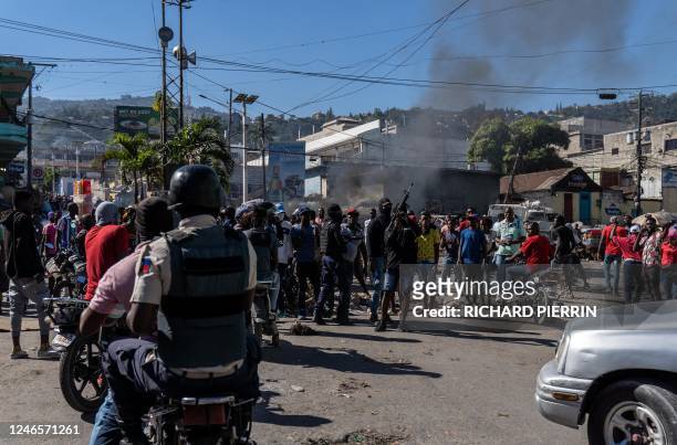 Armed police officers protest after a gang attack on a police station which left six officers dead, in Port-au-Prince, Haiti, January 26, 2023. - The...
