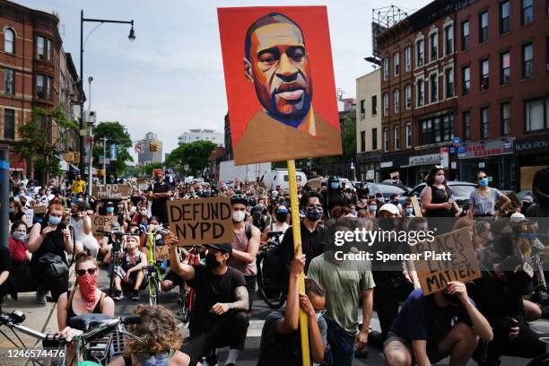 Protesters march in downtown Brooklyn over the killing of George Floyd by a Minneapolis Police officer on June 05, 2020 in New York City. The white...