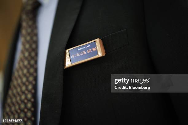 Representative Thomas Massie, a Republican from Kentucky, wears a homemade national debt clock pin on Capitol Hill in Washington, DC, US, on...