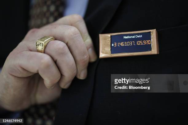 Representative Thomas Massie, a Republican from Kentucky, wears a homemade national debt clock pin on Capitol Hill in Washington, DC, US, on...