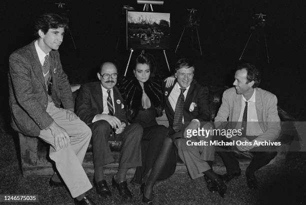 From left to right, photographer Horst Wackerbarth, publisher Alfred van der Marck, Carrie Leigh and her partner, 'Playboy' founder Hugh Hefner , and...