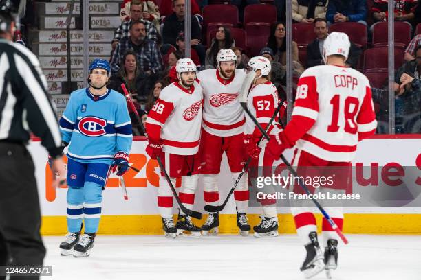 The Detroit Red Wings celebrate after scoring a goal during the first period of the NHL regular season game between the Montreal Canadiens and the...