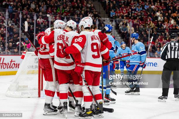 The Detroit Red Wings celebrate after scoring a goal during the second period of the NHL regular season game between the Montreal Canadiens and the...