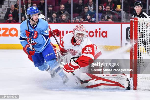 Rafael Harvey-Pinard of the Montreal Canadiens scores on goaltender Ville Husso of the Detroit Red Wings during the second period of the game at...