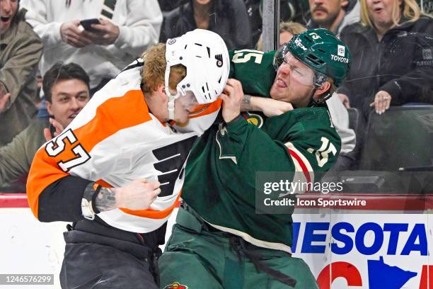 Philadelphia Flyers Right Wing Wade Allison and Minnesota Wild Winger Mason Shaw fight during the first period of a game between the Minnesota Wild...