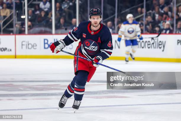 Josh Morrissey of the Winnipeg Jets follows the play down the ice during first period action against the Buffalo Sabres at the Canada Life Centre on...