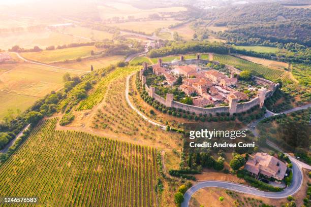 aerial view of monteriggioni at sunset. siena province, tuscany, italy - monteriggioni stock pictures, royalty-free photos & images