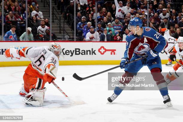 Goaltender John Gibson of the Anaheim Ducks saves a shot by Nathan MacKinnon of the Colorado Avalanche at Ball Arena on January 26, 2023 in Denver,...