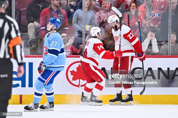 Robby Fabbri of the Detroit Red Wings celebrates his goal with teammate Michael Rasmussen in overtime during the game against the Montreal Canadiens...