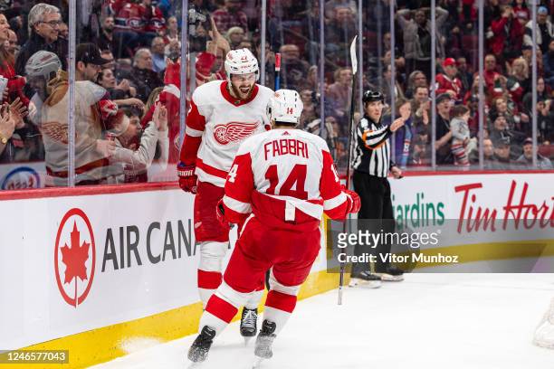 The Detroit Red Wings celebrate after scoring the game-winning goal in overtime during the NHL regular season game against the Montreal Canadiens at...
