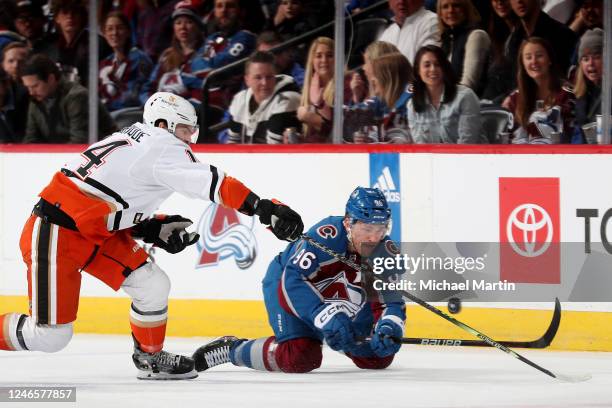 Adam Henrique of the Anaheim Ducks skates against Mikko Rantanen of the Colorado Avalanche at Ball Arena on January 26, 2023 in Denver, Colorado.