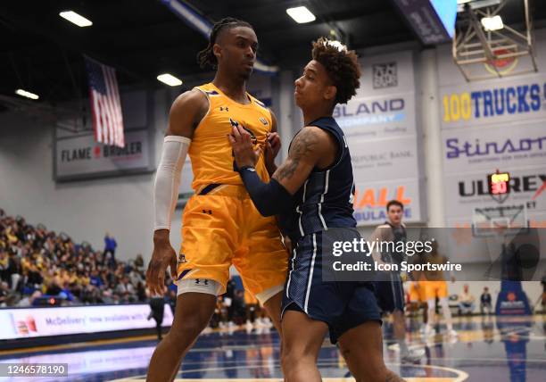 Cal State Bakersfield Roadrunners guard Ivan Reynolds blocks UC Davis Aggies guard Ty Johnson during the game between the UC David and the Cal State...