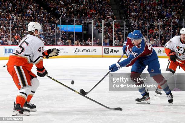 Mikko Rantanen of the Colorado Avalanche skates against Colton White of the Anaheim Ducks at Ball Arena on January 26, 2023 in Denver, Colorado.