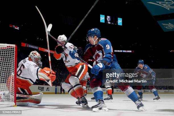 Goaltender John Gibson and Simon Benoit of the Anaheim Ducks defend against Evan Rodrigues of the Colorado Avalanche at Ball Arena on January 26,...
