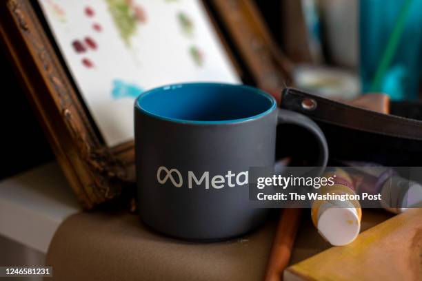 Meta cup is seen on the family art desk at Brit Levys home at Camp Pendleton in Oceanside, Calif., on Wednesday, Jan. 25, 2023. Levy was hired for a...