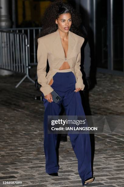 French model Tina Kunakey arrives to attend the Mugler Haute-Couture Spring-Summer 2023 show during the Fashion Week in Paris on January 26, 2023.