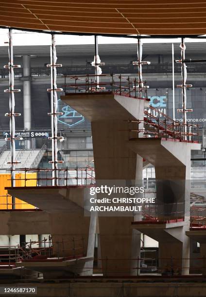 This photograph taken on January 27 shows the construction of diving platforms of the Aquatic Olympic Center , the swimming pool, which will host...