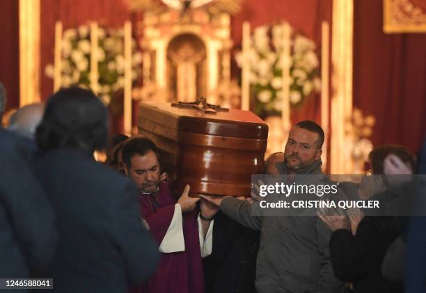 Pallbearers carry the casket of late sacristan Diego Valencia after a funeral mass at the Nuestra Senora de La Palma church on Alta square, where he...