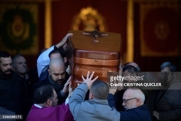 Pallbearers carry the casket of late sacristan Diego Valencia after a funeral mass at the Nuestra Senora de La Palma church on Alta square, where he...