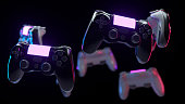 Many console gamepads on black background. Game controller with neon lights