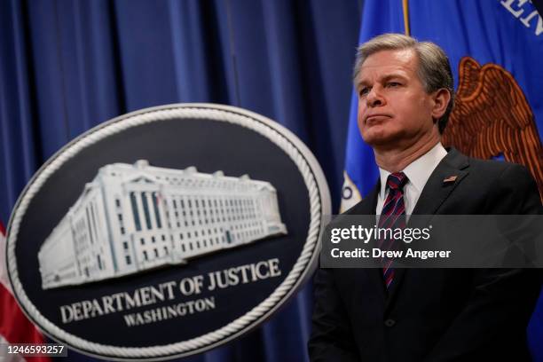 Director Christopher Wray attends a news conference to announce recent law enforcement action in transnational security threats case, at the U.S....