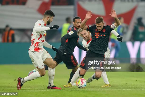 Josko Gvardiol of RB Leipzig, Emil Forsberg of RB Leipzig and Joshua Kimmich of Bayern Muenchen battle for the ball during the Bundesliga match...
