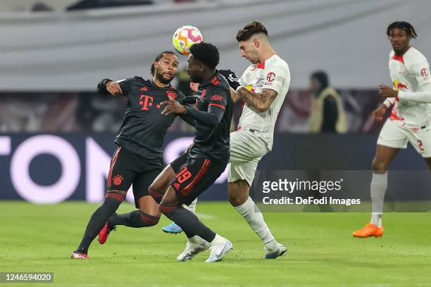 Serge Gnabry of Bayern Muenchen, Alphonso Davies of Bayern Muenchen and Dominik Szoboszlai of RB Leipzig battle for the ball during the Bundesliga...