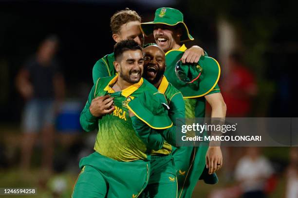 South Africa's Tabraiz Shamsi celebrates with South Africa's Temba Bavuma and South Africa's Anrich Nortje after the dismissal of England's Olly...