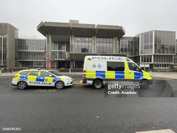 Police vehicles are seen at Hove Town Hall amid a recent revelation of dozens of asylum-seeking children in Britain missing from hotels run by the...