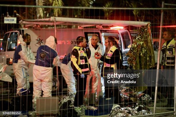 Israeli police investigate the crime scene after 5 people were killed in an armed attack in Jewish settlement at East Jerusalem on January 27, 2023.